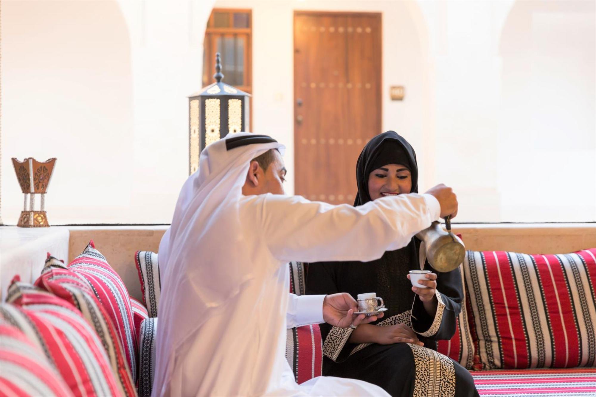 Souq Al Wakra Hotel Qatar By Tivoli Al Wakrah Exterior photo A man and a woman in traditional Arabian dress
